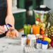 best vitamins for energy - woman taking vitamins and fresh fruit