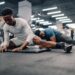 supplements for workout recovery - men stretching at gym